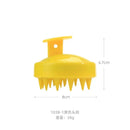 Escova massageadora amarela de silicone com dimensões de 8 cm por 6,7 cm